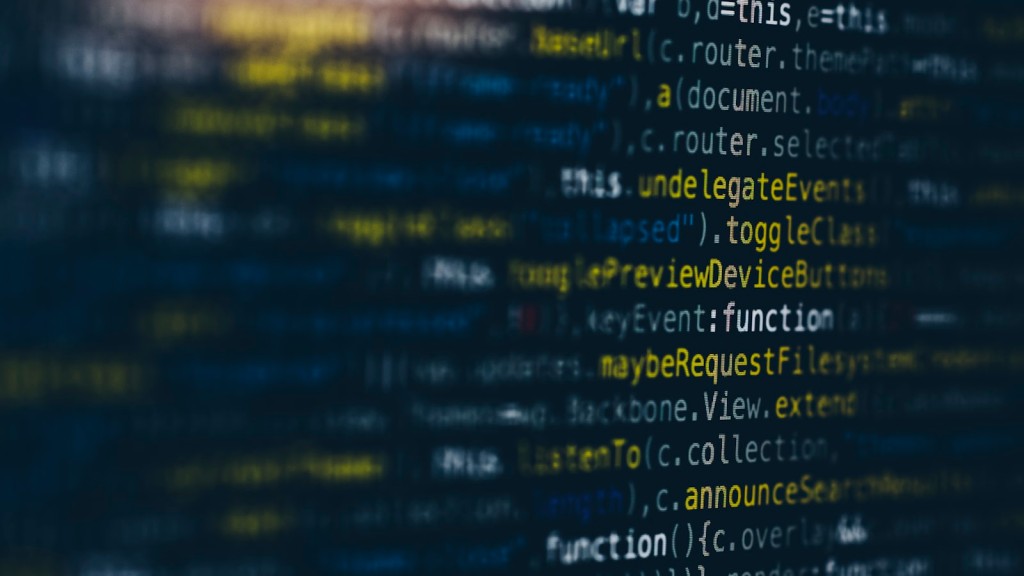 Developer at a multi-monitor desk comparing code in two windows during a language decision